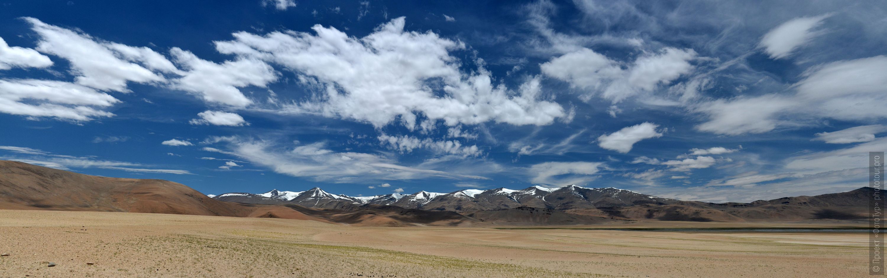 View of the Rupshu Valley from the Taglung La Pass, Ladakh. Tour Tibet Lakeside Advertising: Alpine lakes, geyser valley, Lamayuru, Colored Mountains, 01 - 10.09. 2023 year.